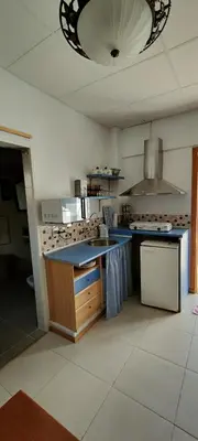 Una cocina o zona de cocina en La Pequeña Parrita