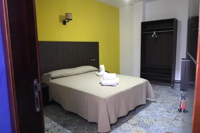 Cama o camas de una habitación en Hospedium DLJ Hostal La Paz