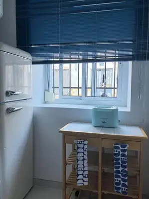 Una cocina o zona de cocina en Renovated retro home w terrace