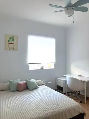 Cama o camas de una habitación en Renovated retro home w terrace