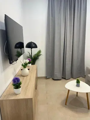 Una televisión o centro de entretenimiento en Orfebre Home