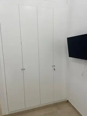 Una televisión o centro de entretenimiento en Orfebre Home