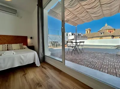 Cama o camas de una habitación en Ático con gran terraza privada - CozyHomeSevilla8