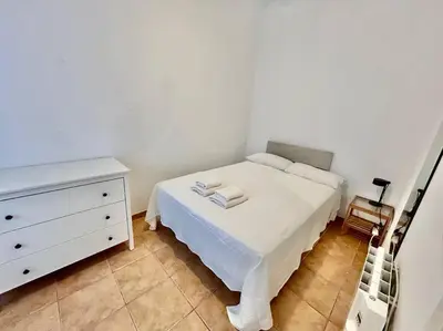 Cama o camas de una habitación en Acogedor apt 8pax 4Bdr 2Bth - CozyHomeSevilla3