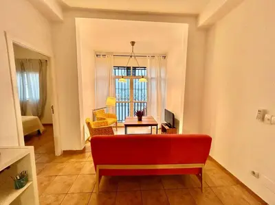 Zona de estar de Acogedor apt 8pax 4Bdr 2Bth - CozyHomeSevilla3