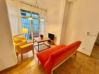 Zona de estar de Acogedor apt 8pax 4Bdr 2Bth - CozyHomeSevilla3