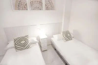 Cama o camas de una habitación en RentalSevilla Marqués de Estella