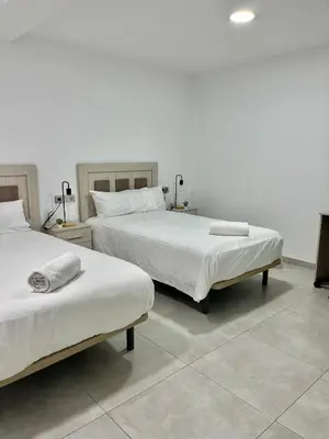 Cama o camas de una habitación en Duplex Agustín M con parking gratuito