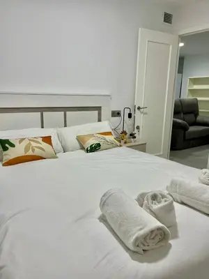Cama o camas de una habitación en Duplex Agustín M con parking gratuito