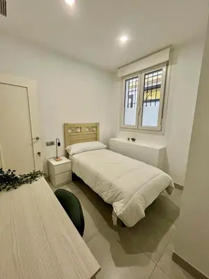 Cama o camas de una habitación en Duplex Agustín M con parking gratuito