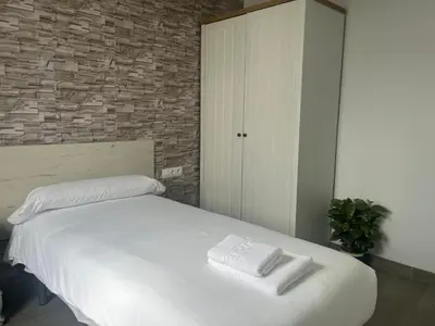 Cama o camas de una habitación en RentalSevilla Cardenal Rodrigo de Castro