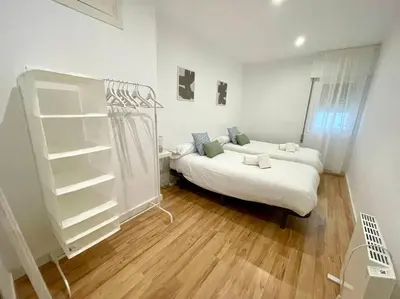 Cama o camas de una habitación en Geysotur Capuchinas parking gratis