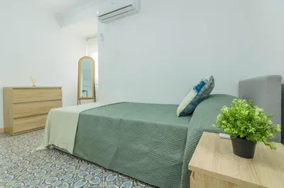 Cama o camas de una habitación en Blue Gardenia Apartmento en Sevilla