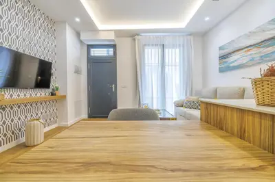 Una televisión o centro de entretenimiento en Apartamento La Victoria & Centro & Parking