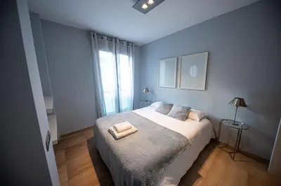 Cama o camas de una habitación en RentitSpain - Jaén - Ático Exlusivo con Balcón Curvo en el Centro