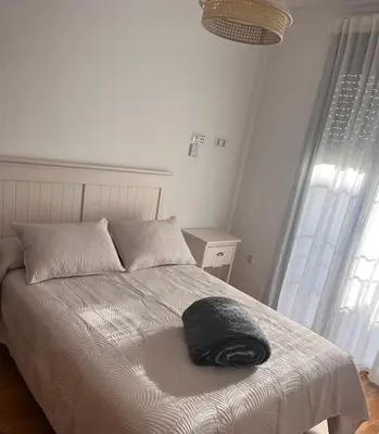 Cama o camas de una habitación en Piso céntrico en zona monumental de Antequera