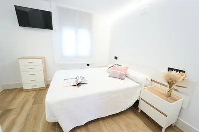 Cama o camas de una habitación en 1ª planta C Apartamentos Juan Robledo Centro ciudad
