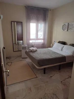 Cama o camas de una habitación en apartamentos barrio nuevo
