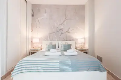 Cama o camas de una habitación en Elegante y acogedor apartamento centro Sevilla Hiniesta 1 habitación