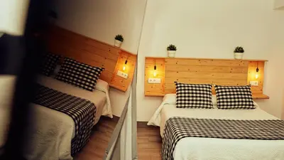 Cama o camas de una habitación en Casas Rurales El Tajo