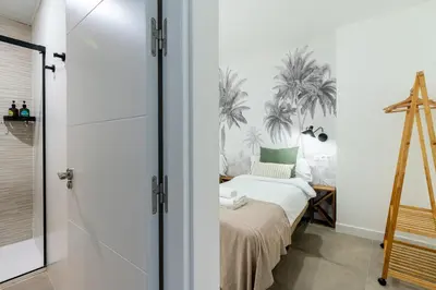 Cama o camas de una habitación en Apartamentos Cano y Cueto , Jardines de Murillo