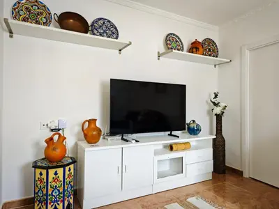 Una televisión o centro de entretenimiento en Casa rural El Nido