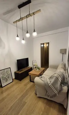 Una televisión o centro de entretenimiento en Hostfy Centro, Calle Sol - San Román
