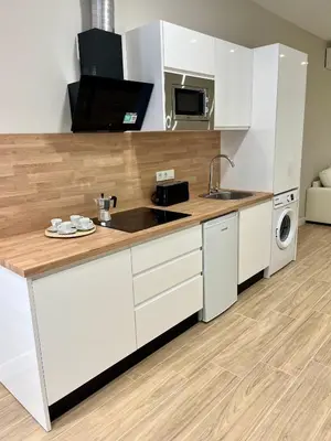 Una cocina o zona de cocina en Jardines Suites GP