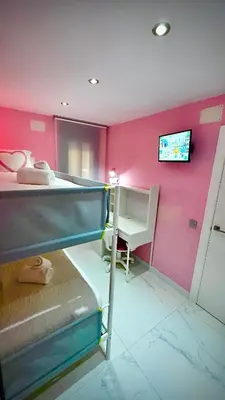 Cama o camas de una habitación en CENTRO, PARKING, PISCINA 2 Dormitorios SUITE PONDOS