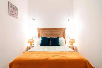 Cama o camas de una habitación en Edomus El Patio de la Macarena