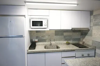 Una cocina o zona de cocina en Apartamentos turísticos ilusiones
