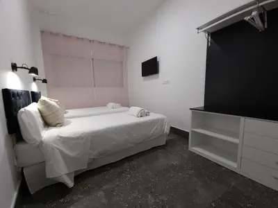Cama o camas de una habitación en CARMELO APARTAMENTo