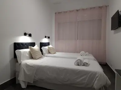 Cama o camas de una habitación en CARMELO APARTAMENTo
