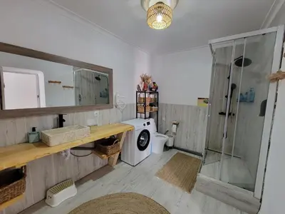 Un baño de House with sauna and fireplace