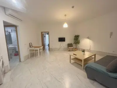 Una televisión o centro de entretenimiento en Center Sevilla Confort 2