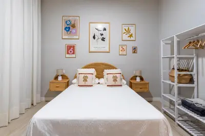 Cama o camas de una habitación en RentalSevilla Plaza de San Quintín