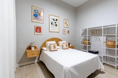 Cama o camas de una habitación en RentalSevilla Plaza de San Quintín