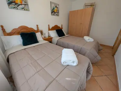 Cama o camas de una habitación en Casa Rural el Olivar Chumi