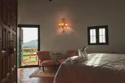 Cama o camas de una habitación en ALOJAMIENTO TURISTICO- AGROTURISMO Dehesa La Pared