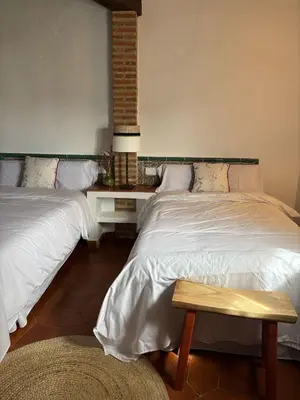 Cama o camas de una habitación en ALOJAMIENTO TURISTICO- AGROTURISMO Dehesa La Pared