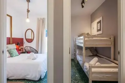 Cama o camas de una habitación en SEVILLA CENTRO GIRALDA 3 dormitorios