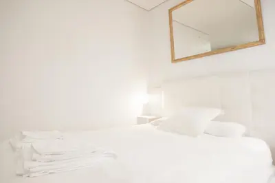 Cama o camas de una habitación en Rentalsevilla Amistad II