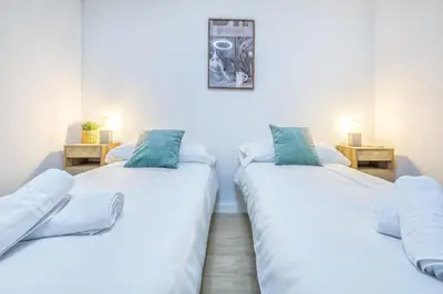 Cama o camas de una habitación en Apto Lope de Sosa junto al casco histórico & Parking Gratuito