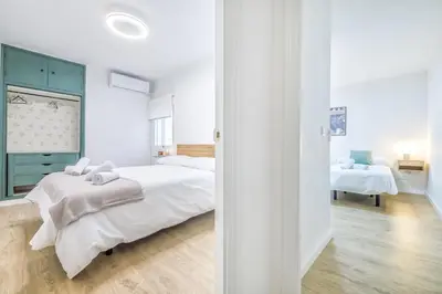 Cama o camas de una habitación en Apto Lope de Sosa junto al casco histórico & Parking Gratuito