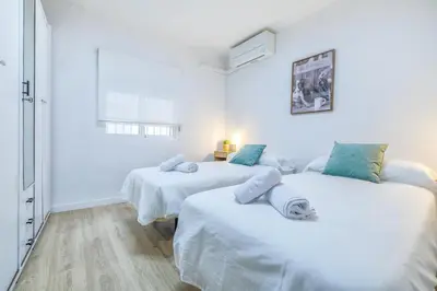 Cama o camas de una habitación en Apto Lope de Sosa junto al casco histórico & Parking Gratuito