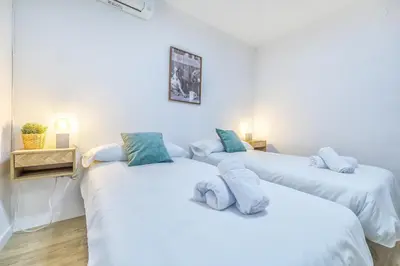 Cama o camas de una habitación en Apto Lope de Sosa junto al casco histórico & Parking Gratuito