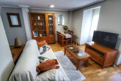 Una televisión o centro de entretenimiento en Apartamento suites HZ centro
