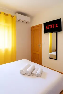 Cama o camas de una habitación en Habitaciones con baños privados a 10 minutos de la Catedral en zona de aparcamientos gratis