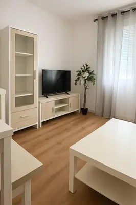 Una televisión o centro de entretenimiento en Alojamiento Baeza - Chicharro