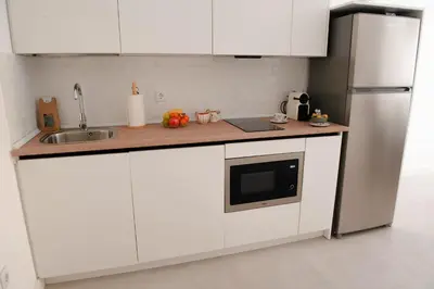 Una cocina o zona de cocina en Optimum Alma del Centro Boutique